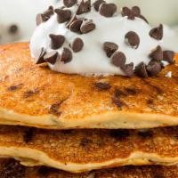 The Chocolate Chip Buttermilk Pancakes · Three pieces of fluffy buttermilk pancakes with fresh chocolate chips bits, served with butt...
