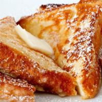 The French Toast · Three pieces of fluffy french toasts, served with syrup.