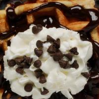 The Chocolate Chip Belgian Waffles · Belgian style waffle crisp to perfection! Topped with chocolate chip bits and syrup.