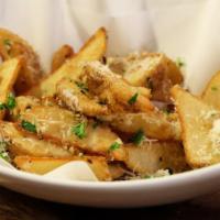 Garlic French Fries · Fresh potatoes crisp-to-perfection topped with  garlic.