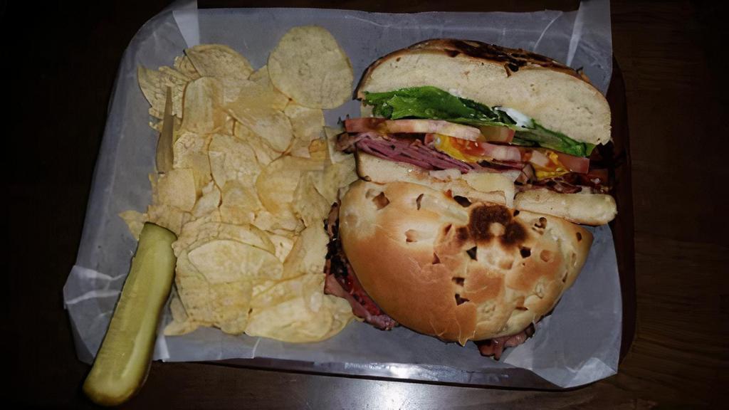 Hot Pastrami · Pastrami, Jack Cheese, Lettuce, Tomato, Mayo, & Mustard on an Onion Roll.   Served with Pickle Spear (On Side) and Chips.