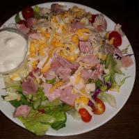 Chef's Salad · Garden salad w/ turkey, ham, cheddar, & provolone cheese w/ choice of dressing on the side. ...