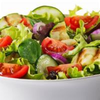 Green Salad · House salad with fresh onions, tomatoes, cucumbers, carrots, and olives.