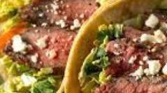 Steak Taco · Grilled Tri Tip Steak topped with mixed salad, salsa, cheddar cheese, green onion and chipot...
