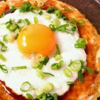 Okonomiyaki · Okonomiyaki is a Japanese savory pancake dish consisting of wheat flour batter and other ing...