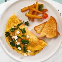 Mediterranean Omelette · Eggs, olives, feta cheese, tomatoes, spinach, and chives. Served with your choice of toast a...