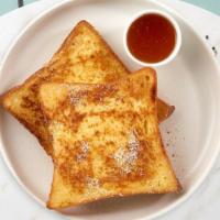 French Toast · Fresh bread battered in egg, milk, and cinnamon cooked until spongy and golden brown. Topped...