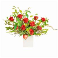 Dozen Roses · Roses are arranged in a loose garden and organic style and placed in a white hammered square...