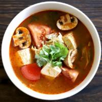 Tom Yum Soup (with Shrimps) · It’s famous hot and sour thai soup with shrimps, tofu, mushroom, tomato and cabbage.