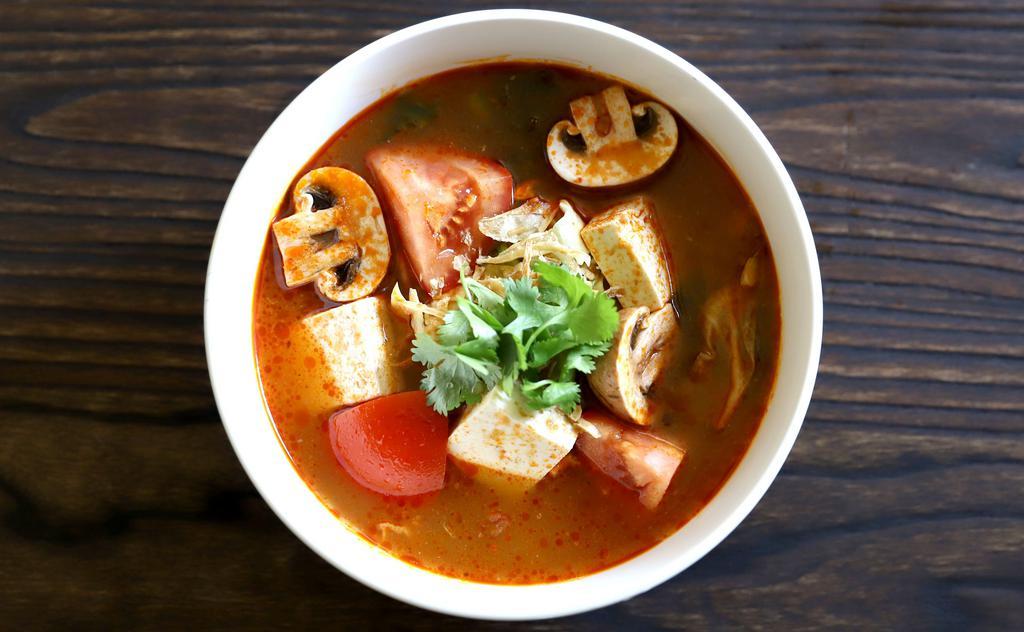 Tom Yum Soup (with Shrimps) · It’s famous hot and sour thai soup with shrimps, tofu, mushroom, tomato and cabbage.