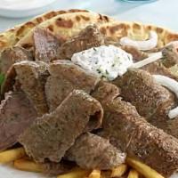 Gyro Plate · Lamb and beef gyro meat served with rice, bread, salad and sauce.