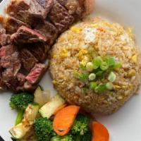 New York Steak · 6oz of New York steak cook in hibachi grill comes  with veggies, steam rice and homemade gin...