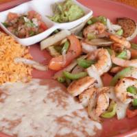 Shrimp Fajitas · Delicious and juicy shrimp sauteed with onions, tomatoes and bell peppers served with warm t...