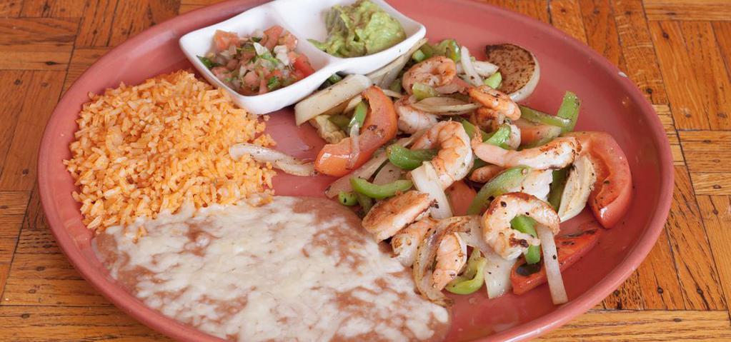Shrimp Fajitas · Shrimp sautéed with onions, tomatoes and  bell peppers. Served with warm tortillas, salsa fresca, guacamole, rice and refried beans on the side .