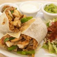 Shrimp Burrito · Flour tortilla wrapped with sautéed grilled onion, tomato, bell peppers, rice and refried be...