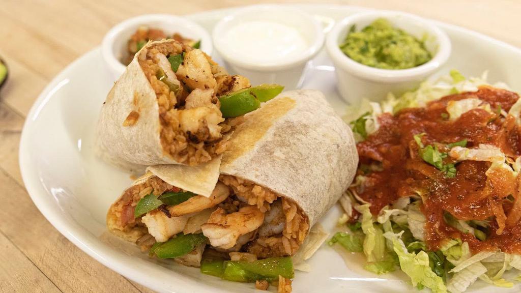 Shrimp Burrito · Flour tortilla wrapped with sautéed grilled onion, tomato, bell peppers, rice and refried beans. Served with guacamole, sour cream, and salsa fresca on the side.