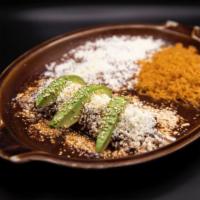 Single Enchilada Poblana · 1 Chicken enchilada topped with homemade mole Poblano, sesame seeds, queso fresco, sliced av...