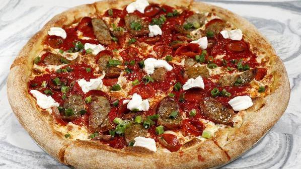 The Wiseguy · Tomato sauce, sliced house-made fennel sausage and calabrese link sausage, ricotta, hot pepper oil, natural case pepperoni, mozzarella, and green onion.
