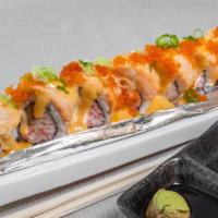 Lion King Roll · Spicy
Inside: Cooked CA roll
Outside: salmon, tobiko, green onion, unagi sauce, spicy mayo