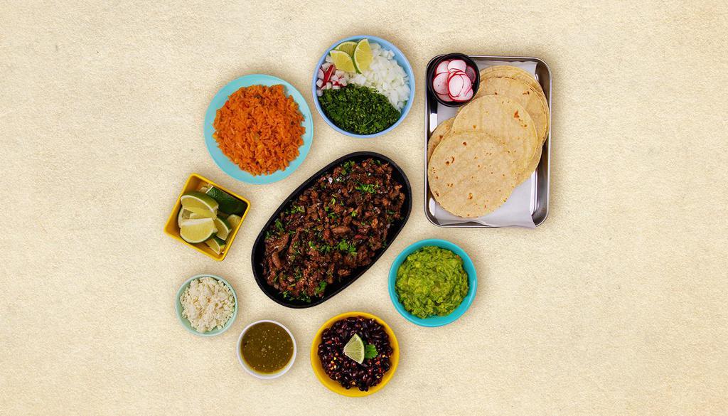 Carne Asada Taco Kit · 1 pound of protein, 12 hand-made corn tortillas, mexican rice, chopped onions, cilantro, shredded cheese, salsa verde, limes.