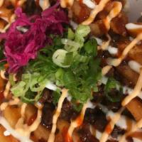 Beef  Fries · Fries with chopped steak on top.
garlic mayo , spicy mayo, and unagi  sauce on top. top with...
