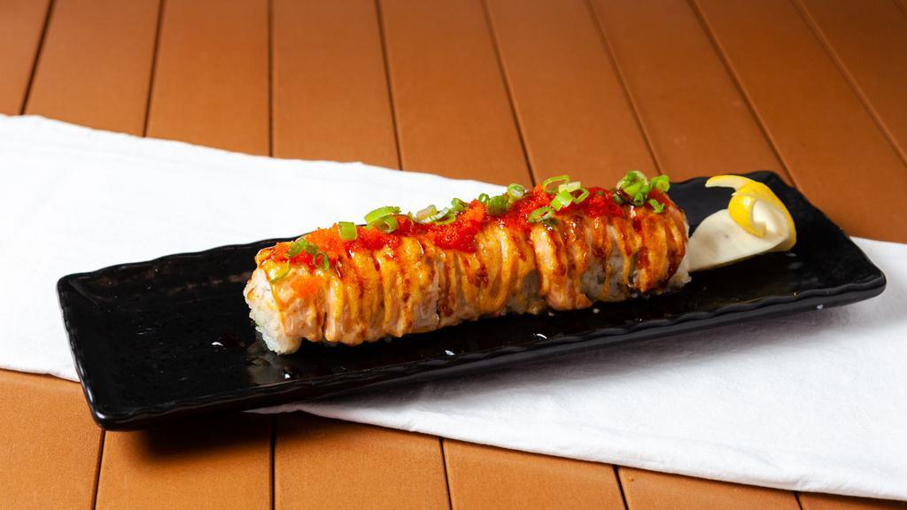 Lion King (8 Pcs) · Crabmeat and Avocado top with bake salmon, unagi sauce, masago, green onion, and sesame seed.
