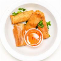 Spring rolls (4 pieces) · 4 pieces of vegetable spring rolls.  Flour roll stuffed with cabbage, peas, carrots and onio...