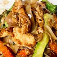 Pad See EW Noodle Bowl · Pan fried rice noodles with Cabbage, Carrot, Celery and Broccoli with choice or protein and ...