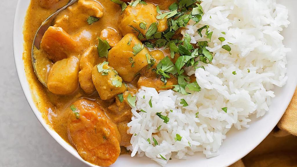 Yellow Curry Bowl · Yellow curry paste with Coconut milk, Potatoes, Carrots, Bell peppers, Onions, Bamboo shoots, Yellow curry paste and your choice of protein on white rice, served with your choice of sauce. Garnished with Cilantro and Green Scallions.