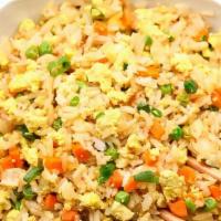 FRIED RICE  (24 oz) · Fried rice with Mixed Vegetables, Garlic, Onions, Carrots and Cabbage.