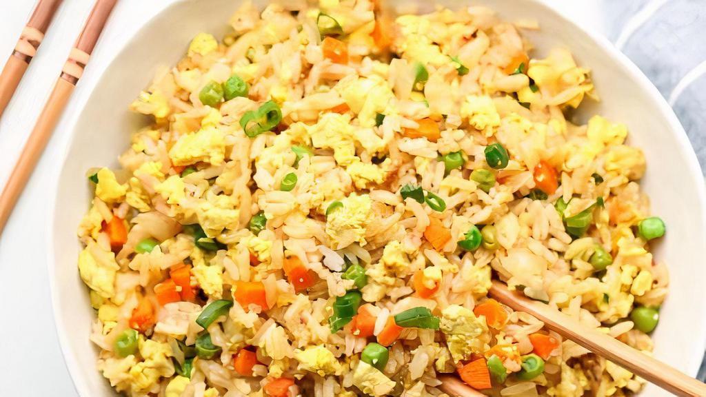 Fried rice (8 oz) · Fried rice with Garlic, Eggs, Onions, Carrots , Peas and Cabbage.
