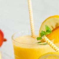 Mango Lemonade · Refreshing mango lemonade served over ice.