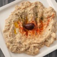 6. Baba Ghanoush · Vegan. Chopped roasted eggplant dip, fresh herbs, yogurt, lemon juice and olive oil.