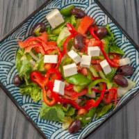 12. Greek Salad · Vegan. Romaine lettuce, tomatoes, cucumbers, bell peppers, kalamata olives, topped with feta...