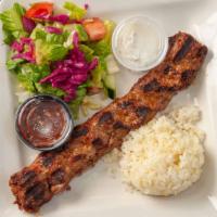 28. Adana Kebab · Charcoal grilled, minced lamb and beef, with parsley,red onion and spices.