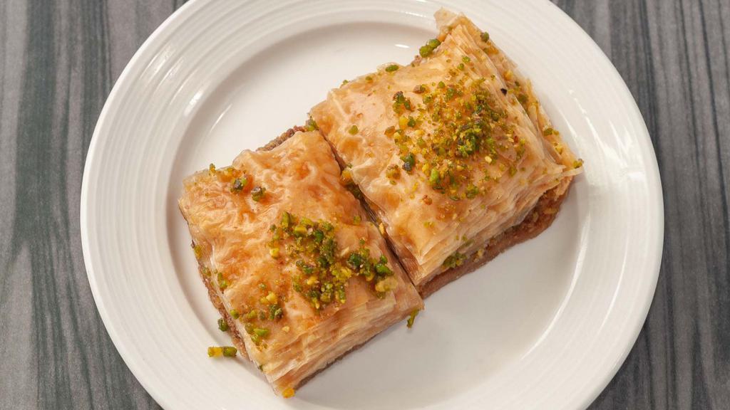 38. Baklava · Vegan. Honey syrup, with walnut baked in phyllo topped with pistachio.