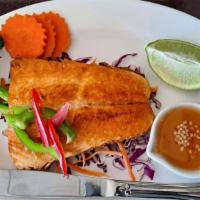 Grilled Salmon · Grilled salmon with side of spicy lime sauce and
slice of fresh lime
