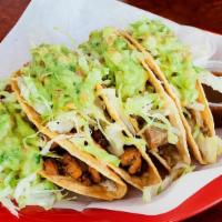 4 Tacos Dorados · Choice of meat, refried beans, cheese, sour cream, lettuce, guacamole, and tomatillo salsa.