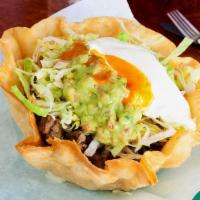 Taco Salad · Bowl-shaped four tortilla with choice of meat, rice, beans, cheese, sour cream, guacamole, a...