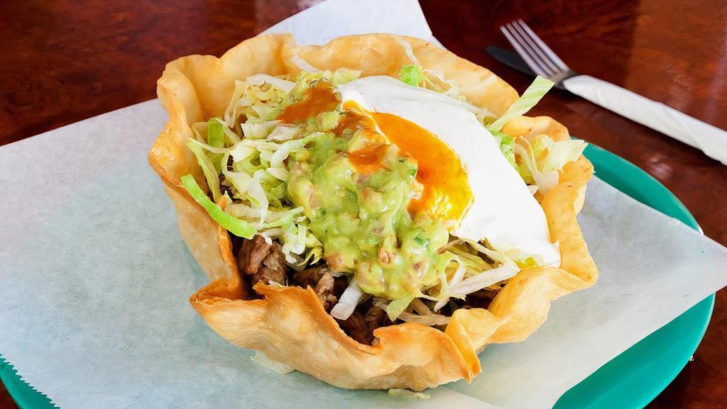 Taco Salad · Bowl-shaped four tortilla with choice of meat, rice, beans, cheese, sour cream, guacamole, and lettuce.