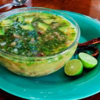 Carne en su Jugo · Unique Family Recipe: 
Beef broth poured in a bowl with carne asada, bacon, whole beans, oni...