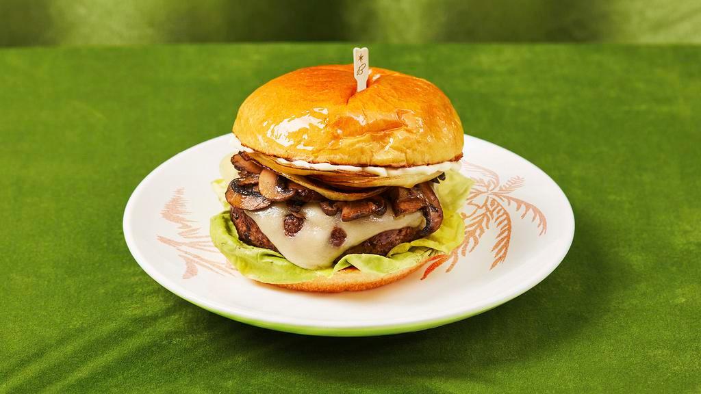 Mushroom Swiss Burger · Juicy burger with swiss cheese, mushrooms, onions, lettuce, and mayo.