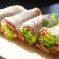 Nem Nuong Spring Rolls · Fresh herbs and veggies, fried eggroll wrapper, and pork patty sausage with special dipping ...