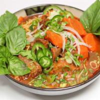 Mi Bo Kho (Beef Stew with Egg Noodles) · Fork tender beef, beef tendon, carrots with egg noodles