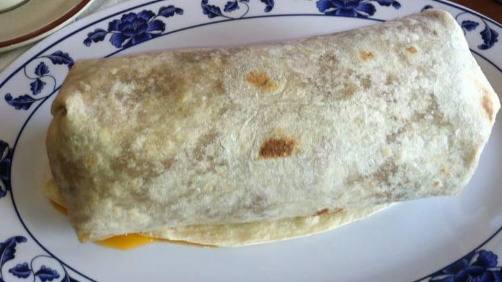 Breakfast Burrito · All breakfast burritos come with choice of meat, eggs, beans, rice, onions, cilantro, and red hot sauce