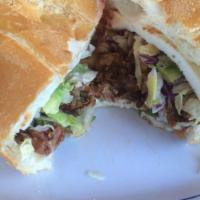 Torta · Your choice of meat with avocado, tomato, lettuce, sour cream, onions, cilantro and hot sauc...