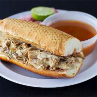 Torta Ahogadas with a golden taco · Wet torta (beans, relish purple onion, tomato sauce) with your choice of meat  with a golden...
