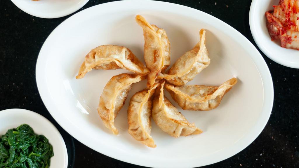 Pot Stickers (4 Pieces) · Deep fried dumpling with vegetables and meat inside.