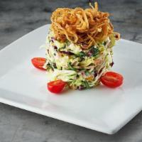 Ruth'S Chopped Salad · julienne iceberg lettuce, baby spinach, radicchio, red onions, mushrooms, green olives, baco...