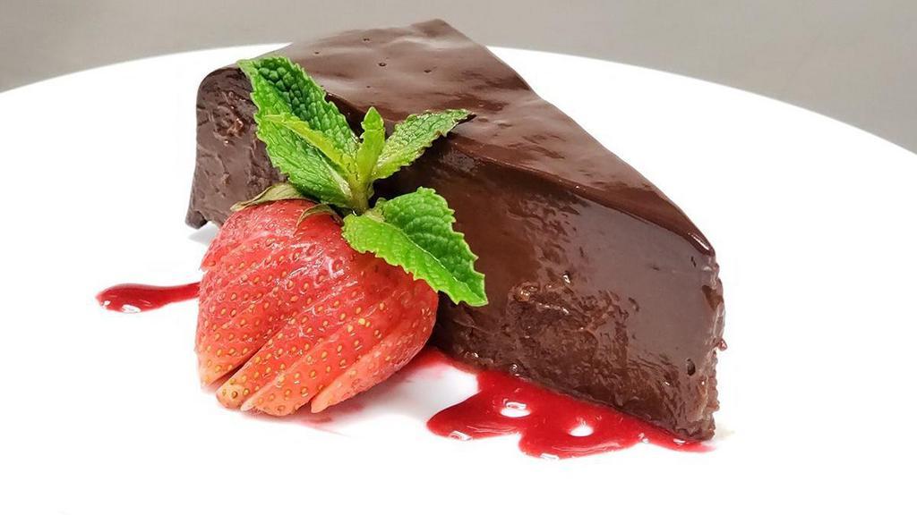 Chocolate Sin Cake · rich flourless cake, ganache, raspberry sauce | GF